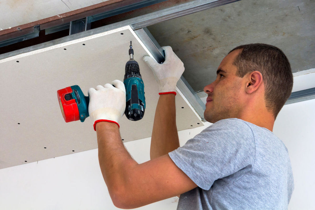 Man screwing into plasterboard
